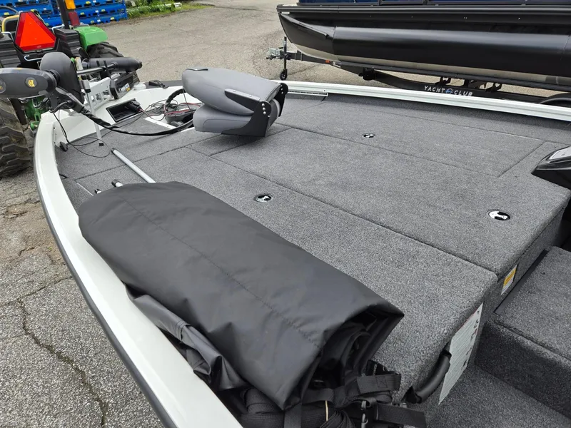 Slide: The Image of 2025 Lowe Stinger 195 Bass boat with spacious deck and modern seating. - 10