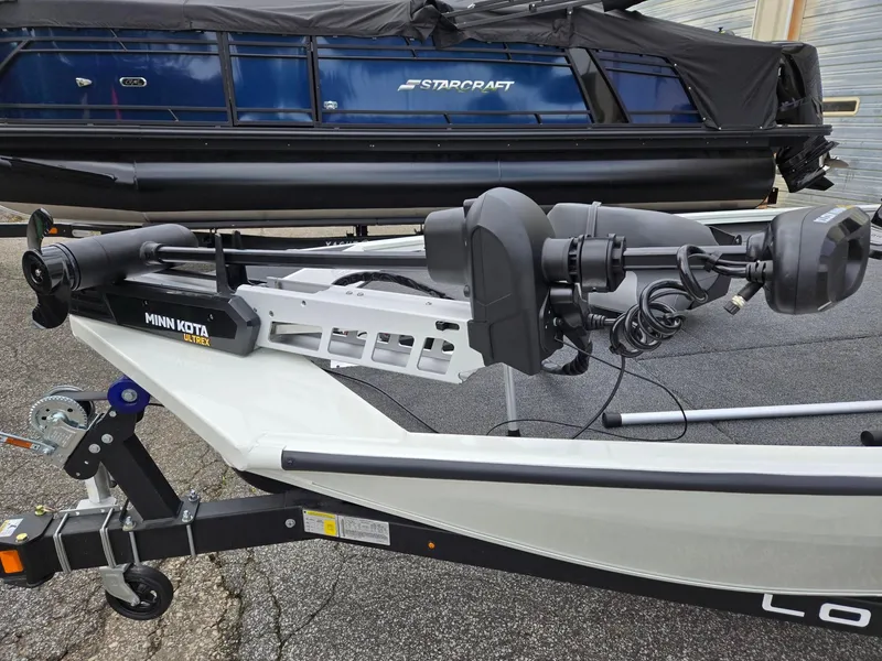Slide: The Image of 2025 Lowe Stinger 195 Bass boat with Minn Kota Ultrex motor on trailer. - 3
