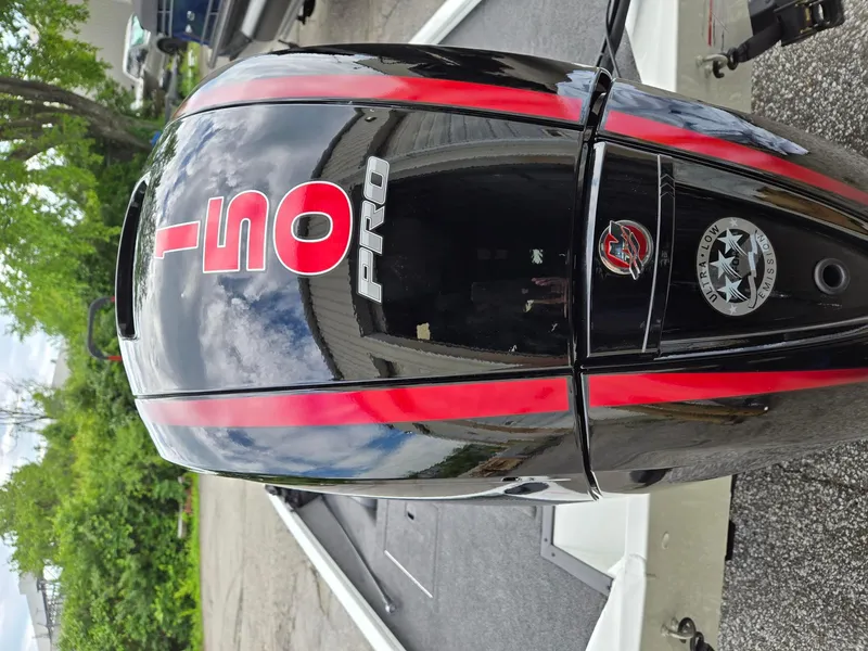 Slide: The Image of 2025 Lowe Stinger 195 Bass boat with 150 Pro outboard motor, featuring red accents. - 5