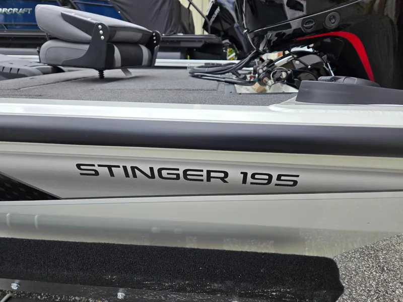Slide: The Image of 2025 Lowe Stinger 195 Bass boat, close-up of seating and branding. - 6