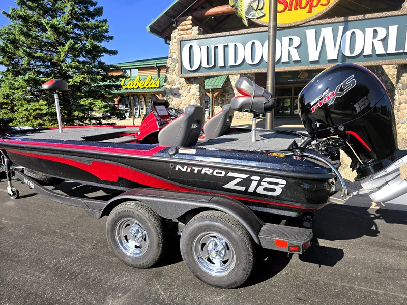 Slide: The Image of 2025 Nitro Z18 Pro boat displayed outside Outdoor World store. - 1