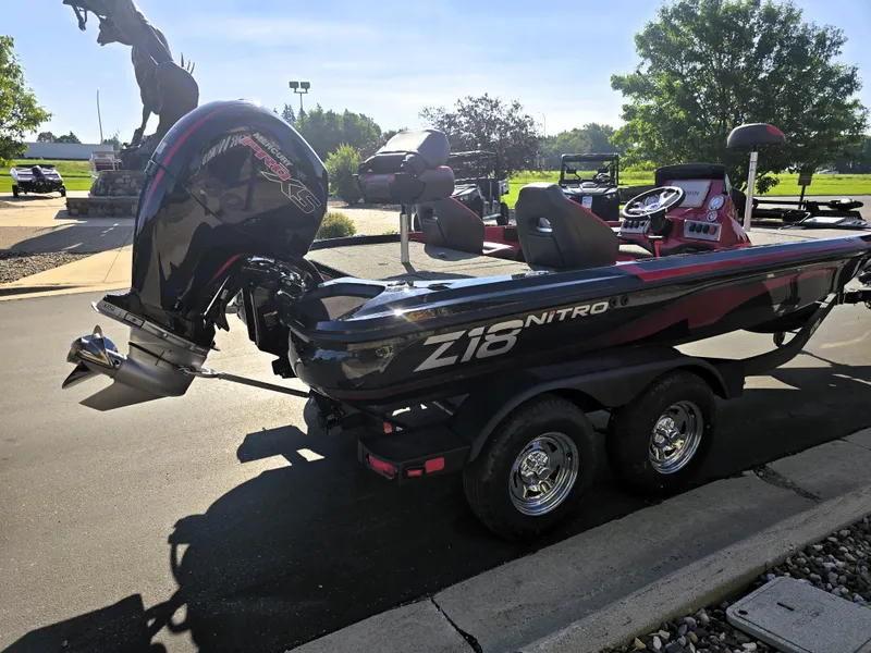Slide: The Image of 2025 Nitro Z18 Pro boat on trailer, parked outdoors in sunny setting. - 4