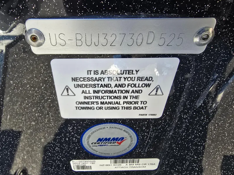 Slide: The Image of ```markdown
Boat identification plate on Nitro Z18 Pro 2025 with safety instructions and NMMA certification.
``` - 6
