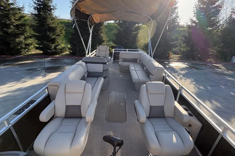 Slide: The Image of 2025 Sun Tracker Sportfish 24 XP3 pontoon boat with spacious seating and canopy. - 69