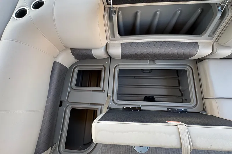 Slide: The Image of 2025 Sun Tracker Sportfish 24 XP3 boat interior storage compartments. - 76