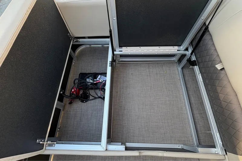 Slide: The Image of Under-seat storage compartment in 2025 Sun Tracker Sportfish 24 XP3 boat. - 78