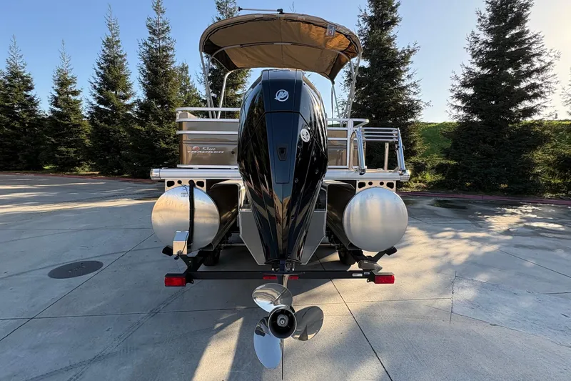 Slide: The Image of 2025 Sun Tracker Sportfish 24 XP3 pontoon boat with powerful outboard motor. - 79