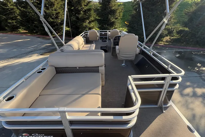 Slide: The Image of 2025 Sun Tracker Sportfish 24 XP3 pontoon boat with spacious seating and modern design. - 80
