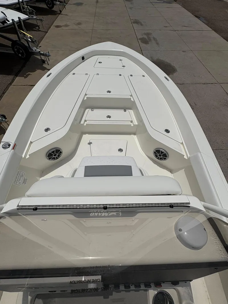 Slide: The Image of 2025 Mako 24 APEX boat interior with seating and storage compartments. - 5