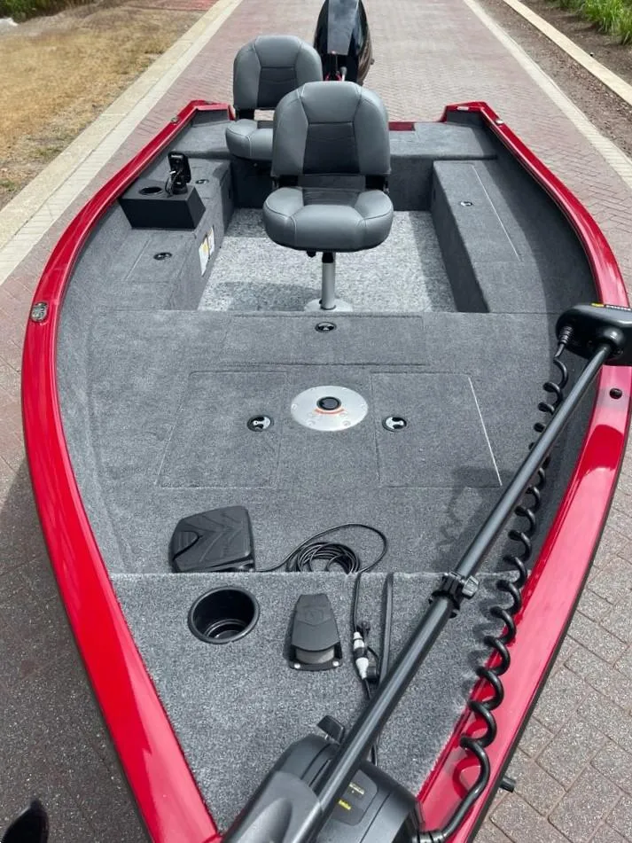 Slide: The Image of 2025 Tracker Super Guide V-16 T fishing boat with red exterior and dual seats. - 4