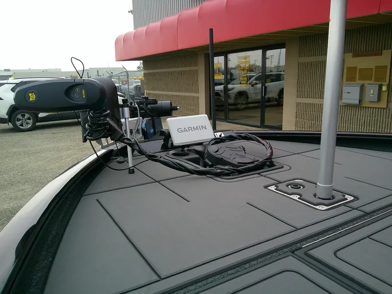 Slide: The Image of 2025 Tracker Savage 215 boat with Garmin navigation system and trolling motor. - 6