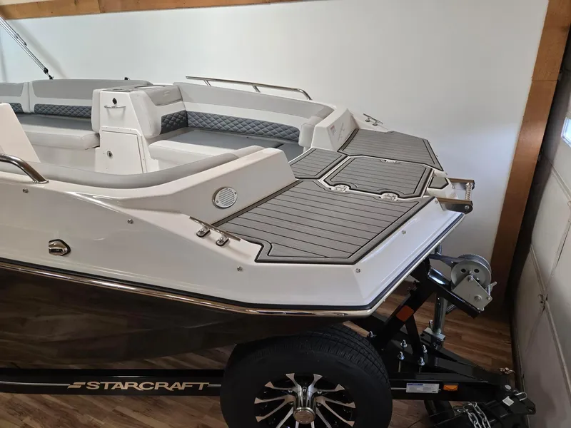 Slide: The Image of 2025 Starcraft SVX211OB boat on trailer, featuring sleek design and spacious seating. - 3