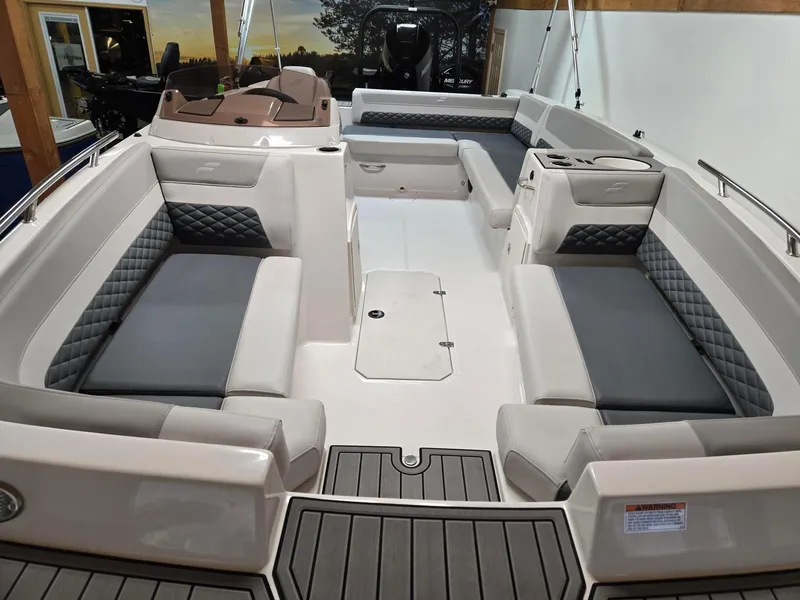 Slide: The Image of 2025 Starcraft SVX211OB boat interior with cushioned seating and modern design. - 4