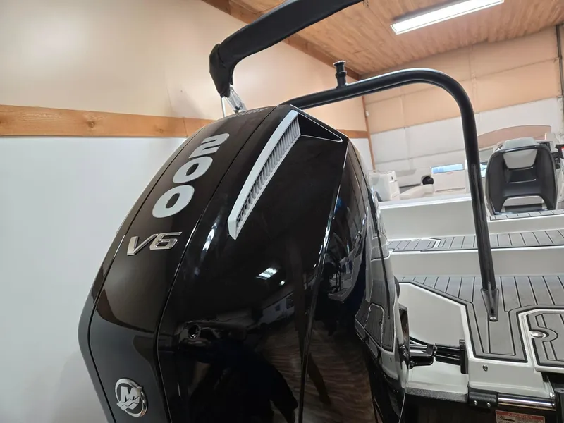 Slide: The Image of 2025 Starcraft SVX211OB boat with a 200 V6 engine in a showroom. - 8