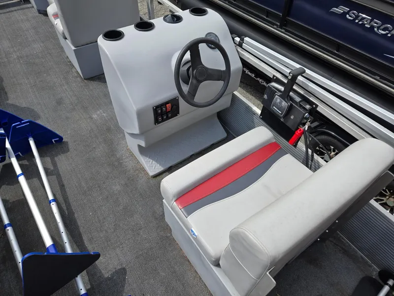 Slide: The Image of 1988 Sweetwater Executive Cruiser boat interior with steering wheel and seating. - 5