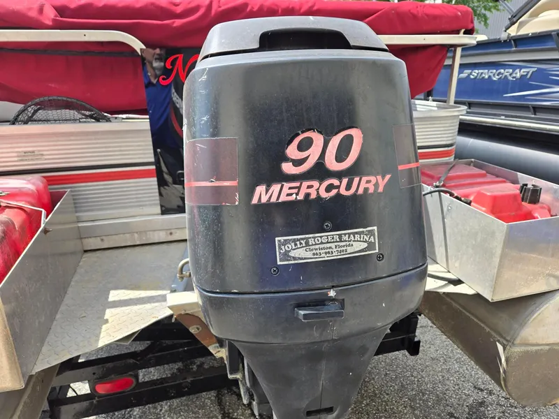 Slide: The Image of 1988 Sweetwater Executive Cruiser with Mercury 90 outboard motor, Jolly Roger Marina label. - 7