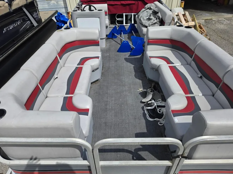 Slide: The Image of 1988 Sweetwater Executive Cruiser pontoon boat interior with gray and red seating. - 8