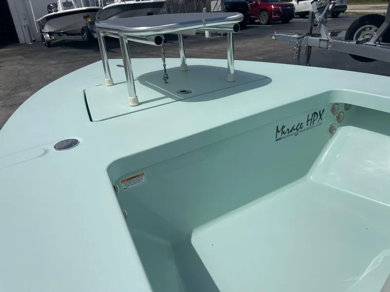 Slide: The Image of 2025 Maverick 17 HPX-S boat deck, light blue color, with stainless steel fittings. - 2
