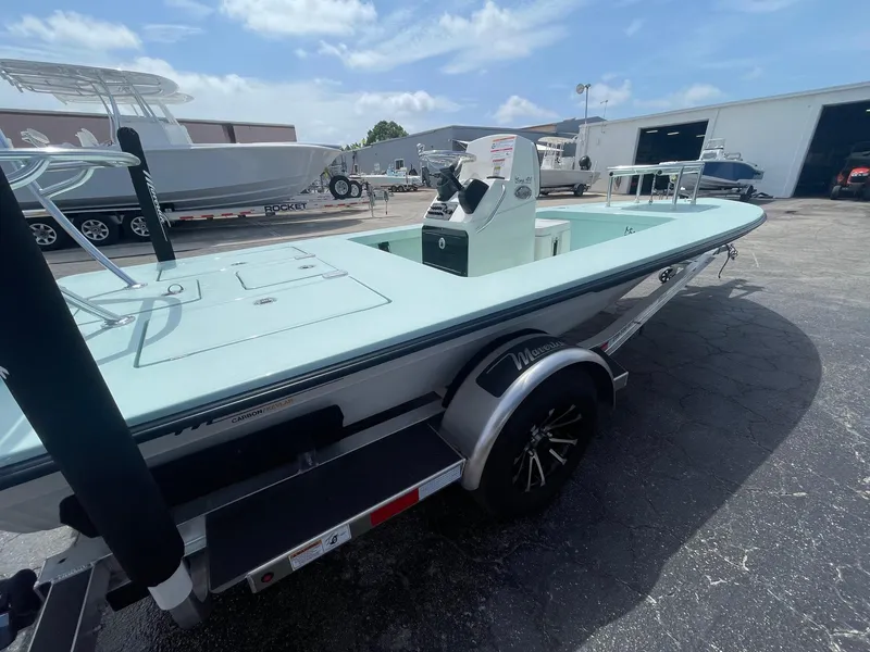 Slide: The Image of 2025 Maverick 17 HPX-S boat on trailer, parked outdoors under a clear sky. - 5