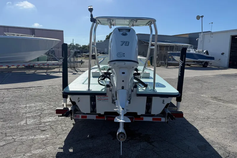 Slide: The Image of 2025 Maverick 17 HPX-S boat with outboard motor in a sunny marina setting. - 9