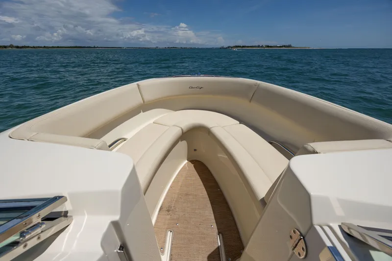 Slide: The Image of 2022 Chris-Craft Launch 27 boat interior with beige seating on open water. - 19