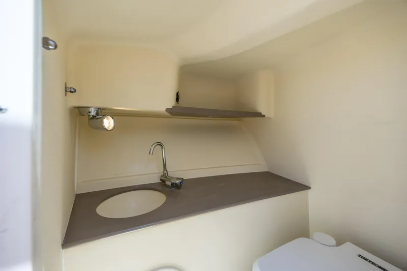 Slide: The Image of 2022 Chris-Craft Launch 27 boat interior with sink and toilet. - 22