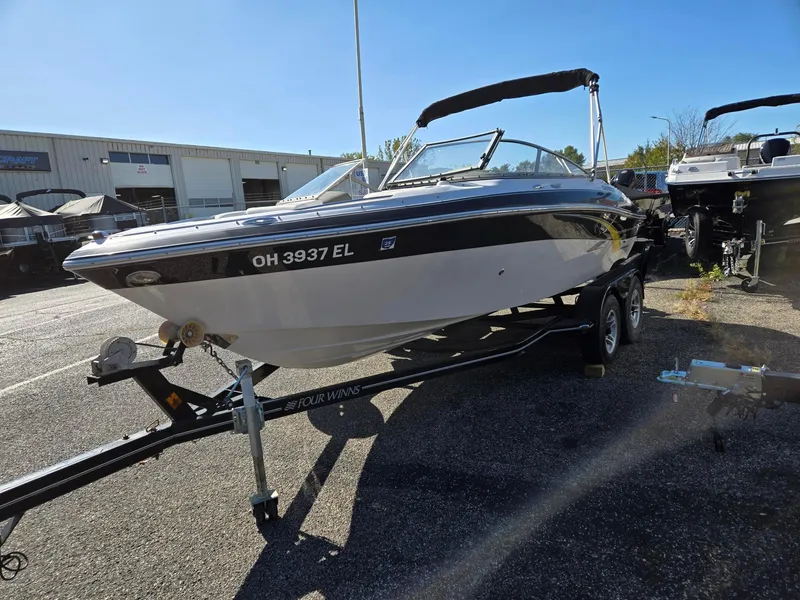 Slide: The Image of 2007 Four Winns 200 Horizon boat on trailer in parking lot. - 3
