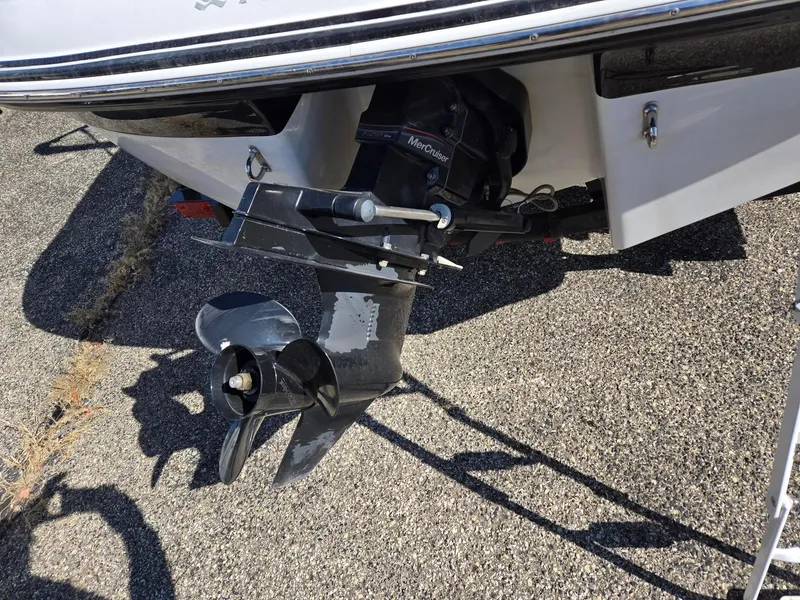 Slide: The Image of 2007 Four Winns 200 Horizon boat with MerCruiser outdrive on asphalt surface. - 6