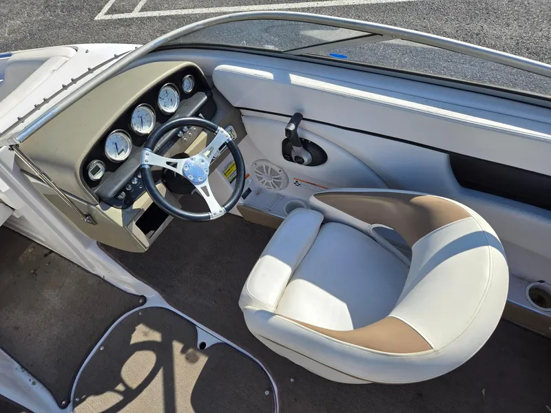 Slide: The Image of 2007 Four Winns 200 Horizon boat interior with steering wheel and dashboard gauges. - 8