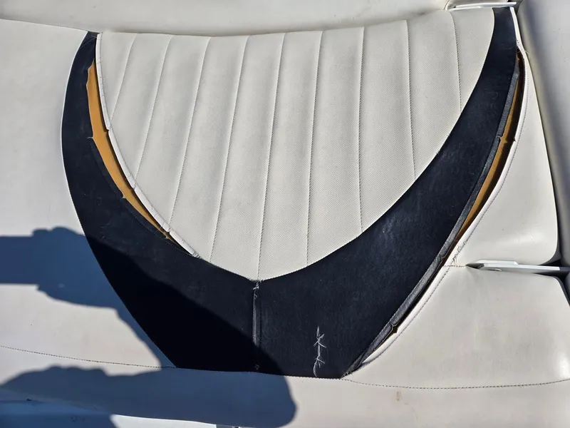Slide: The Image of Torn upholstery on 2007 Four Winns 200 Horizon boat seat. - 9