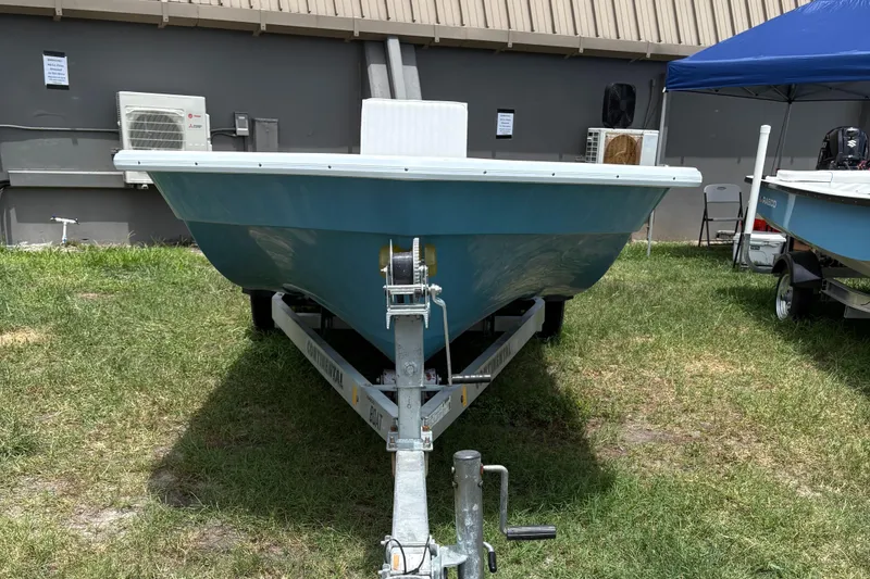 Slide: The Image of 2025 Rabco Buccaneer boat on trailer, displayed outdoors. - 3