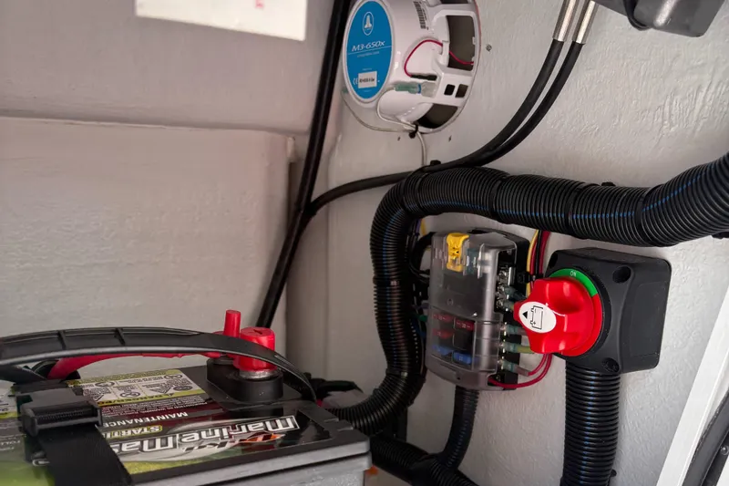 Slide: The Image of Electrical system in a 2025 Rabco Buccaneer boat, featuring battery and wiring components. - 4