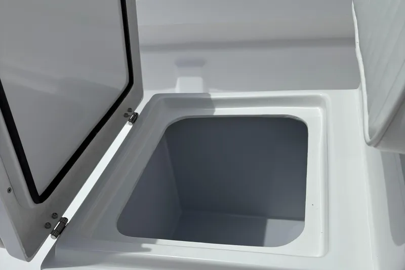 Slide: The Image of Open storage compartment on 2025 Rabco Buccaneer boat, showcasing interior space. - 6