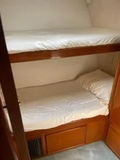 Slide: The Image of Bunk beds in the cabin of a 1997 Post 50 Flybridge yacht. - 10