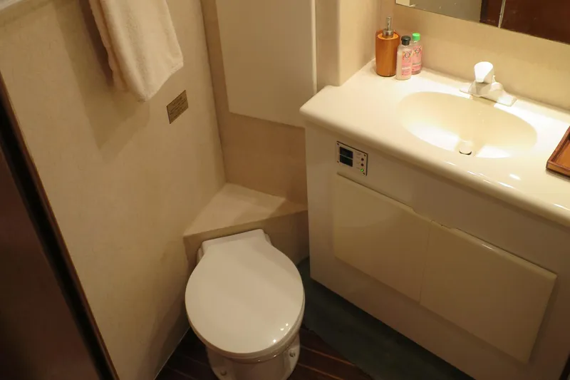 Slide: The Image of 1997 Post 50 Flybridge yacht bathroom with toilet and sink. - 14