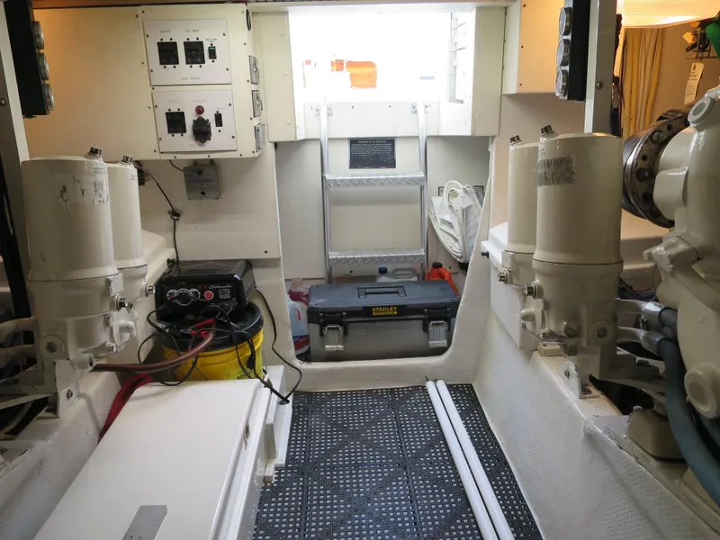 Slide: The Image of Engine room of a 1997 Post 50 Flybridge yacht with equipment and control panels. - 19