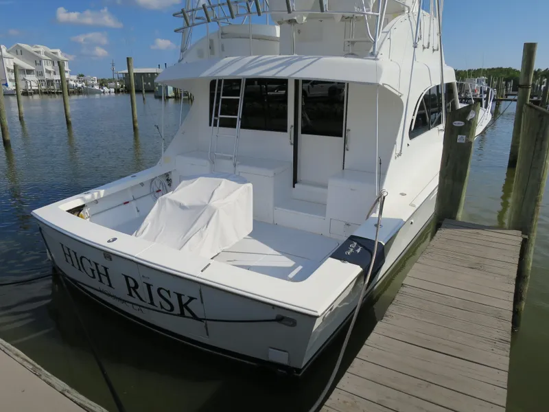 Slide: The Image of 1997 Post 50 Flybridge yacht docked, named High Risk. - 2