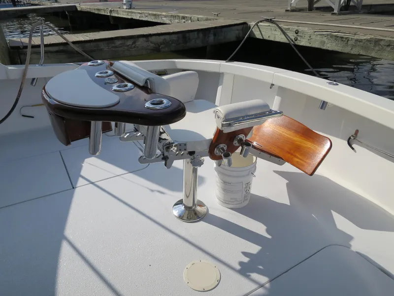 Slide: The Image of 1997 Post 50 Flybridge fishing chair and rod holders on deck. - 3