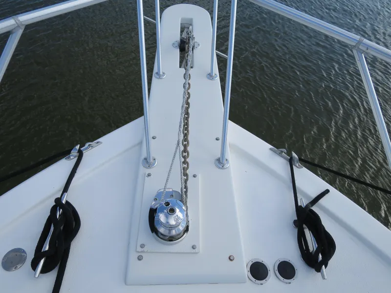 Slide: The Image of Bow of 1997 Post 50 Flybridge yacht with anchor chain and winch. - 6
