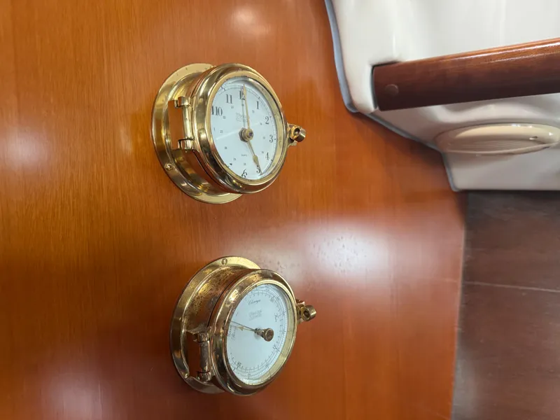 Slide: The Image of Brass clock and barometer on Beneteau Oceanis Clipper 373, 2005 model, wooden interior. - 16