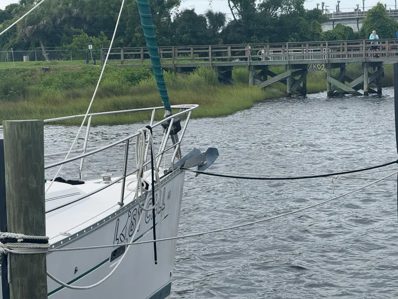 Slide: The Image of Beneteau Oceanis Clipper 373 sailboat docked by a wooden bridge, 2005 model. - 19