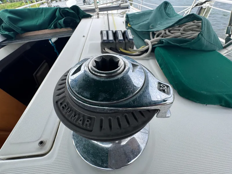 Slide: The Image of Winch on 2005 Beneteau Oceanis Clipper 373 sailboat deck with green covers. - 21