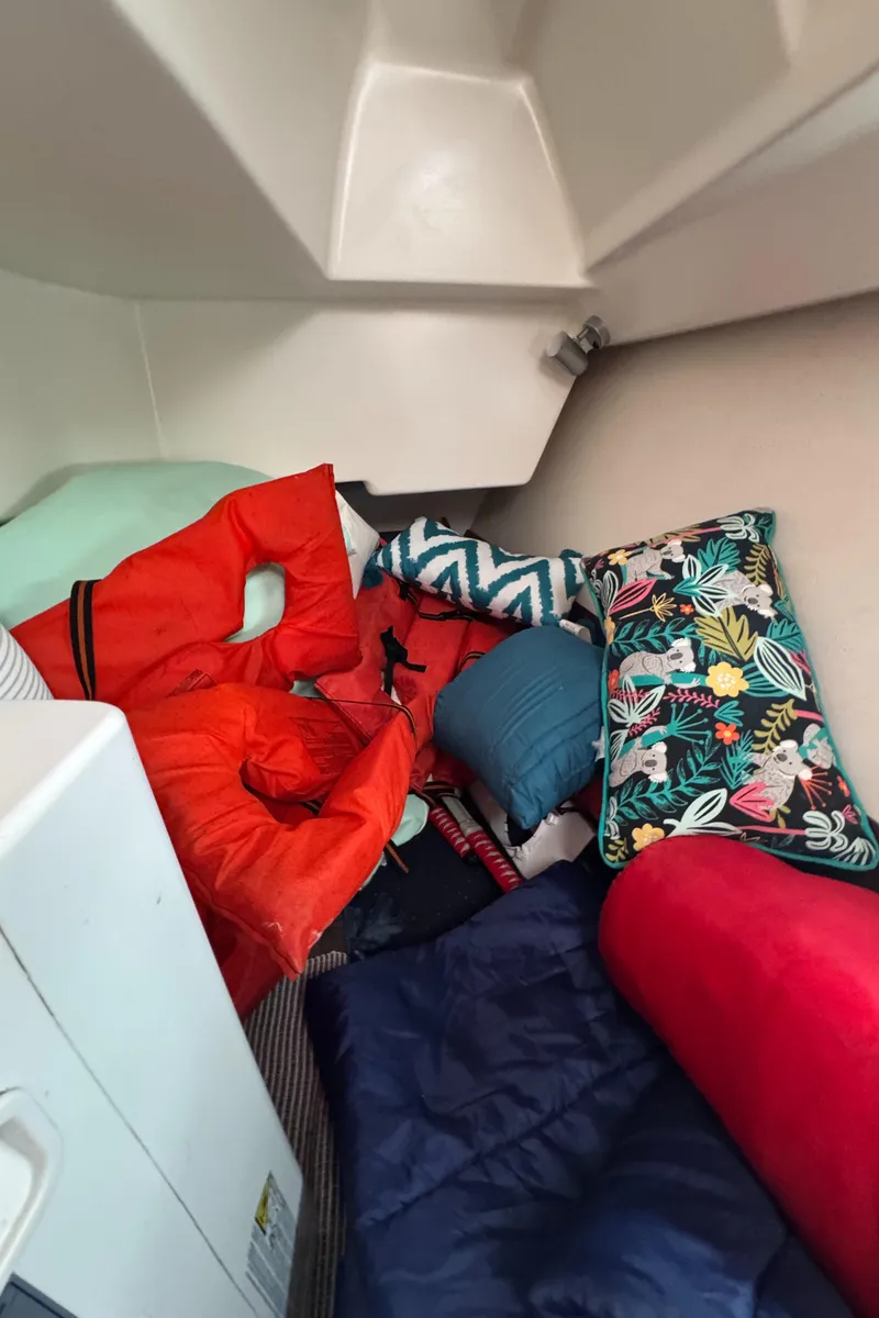 Slide: The Image of Cozy cabin interior of 2005 Beneteau Oceanis Clipper 373 with colorful cushions and life jacket. - 30
