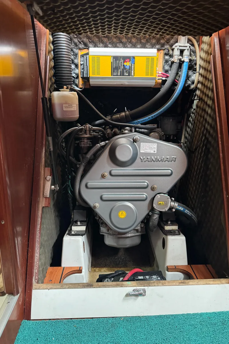 Slide: The Image of Engine compartment of a 2005 Beneteau Oceanis Clipper 373 sailboat, featuring a Yanmar engine. - 32
