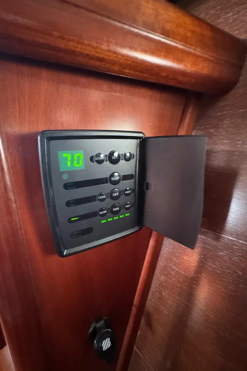 Slide: The Image of Control panel inside 2005 Beneteau Oceanis Clipper 373 yacht, displaying temperature settings. - 34