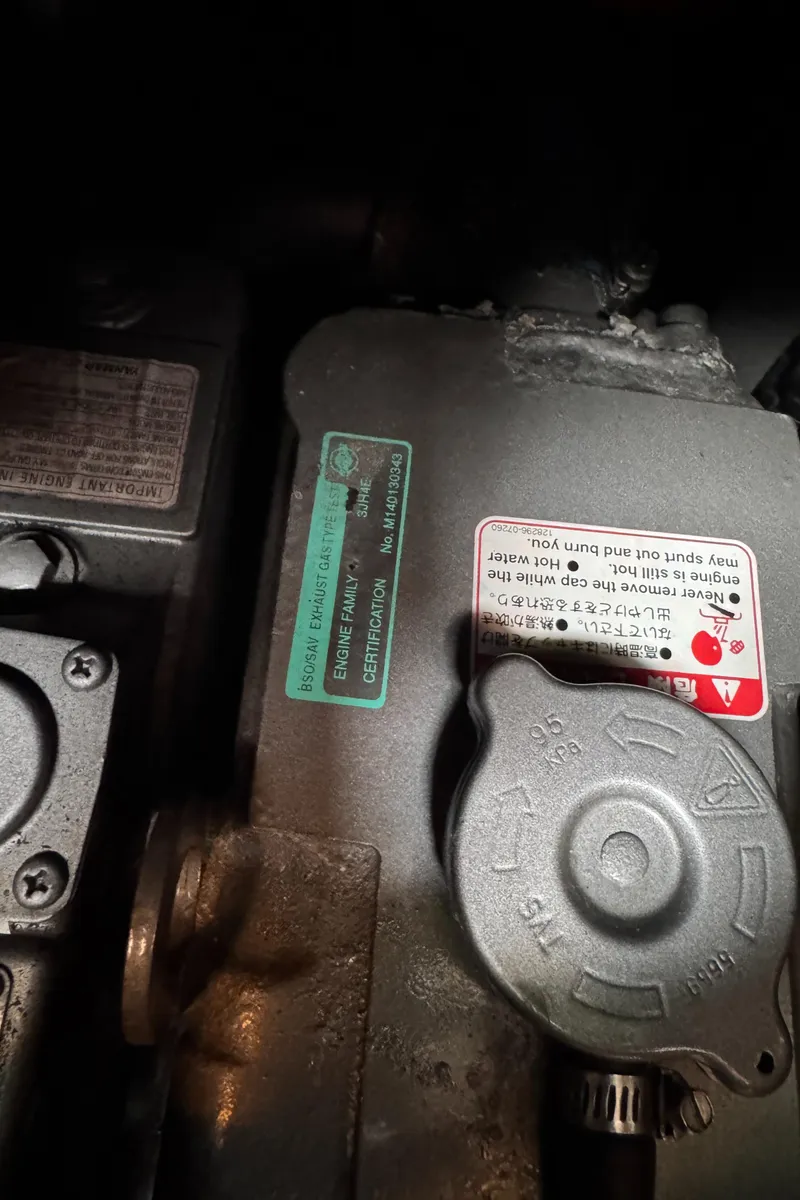 Slide: The Image of Engine compartment of 2005 Beneteau Oceanis Clipper 373 sailboat, showing certification labels and components. - 36