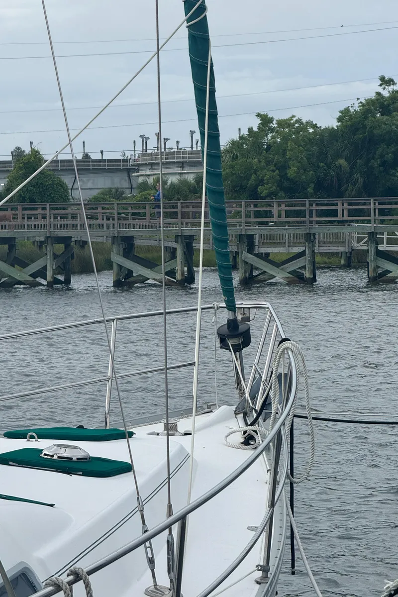 Slide: The Image of 2005 Beneteau Oceanis Clipper 373 sailboat docked near wooden pier. - 39