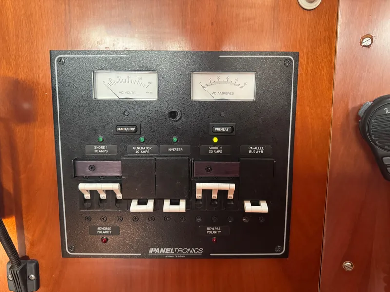 Slide: The Image of Electrical panel on a 2005 Beneteau Oceanis Clipper 373 sailboat, featuring voltage and amperage gauges. - 8