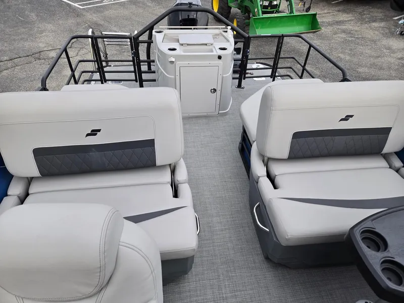 Slide: The Image of 2024 Starcraft CX25RL boat interior with plush seating and modern design. - 10