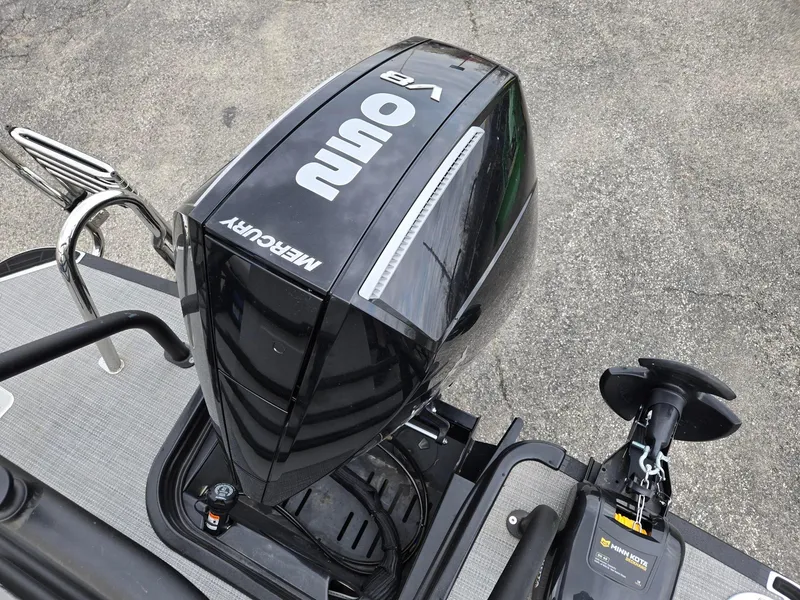 Slide: The Image of 2024 Starcraft CX25RL boat with Mercury V8 outboard motor and Minn Kota trolling motor. - 11